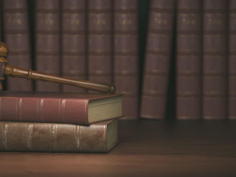 Gavel on the background of vintage lawyer books. Concept of law Gavel on the background of vintage lawyer books. Concept of law and justice. 3d illustration